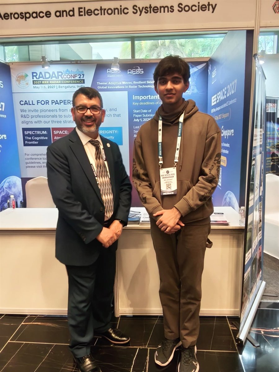Neil Akhawat with the President of IEEE at the AESS pavilion, IEEE SPACE 2026